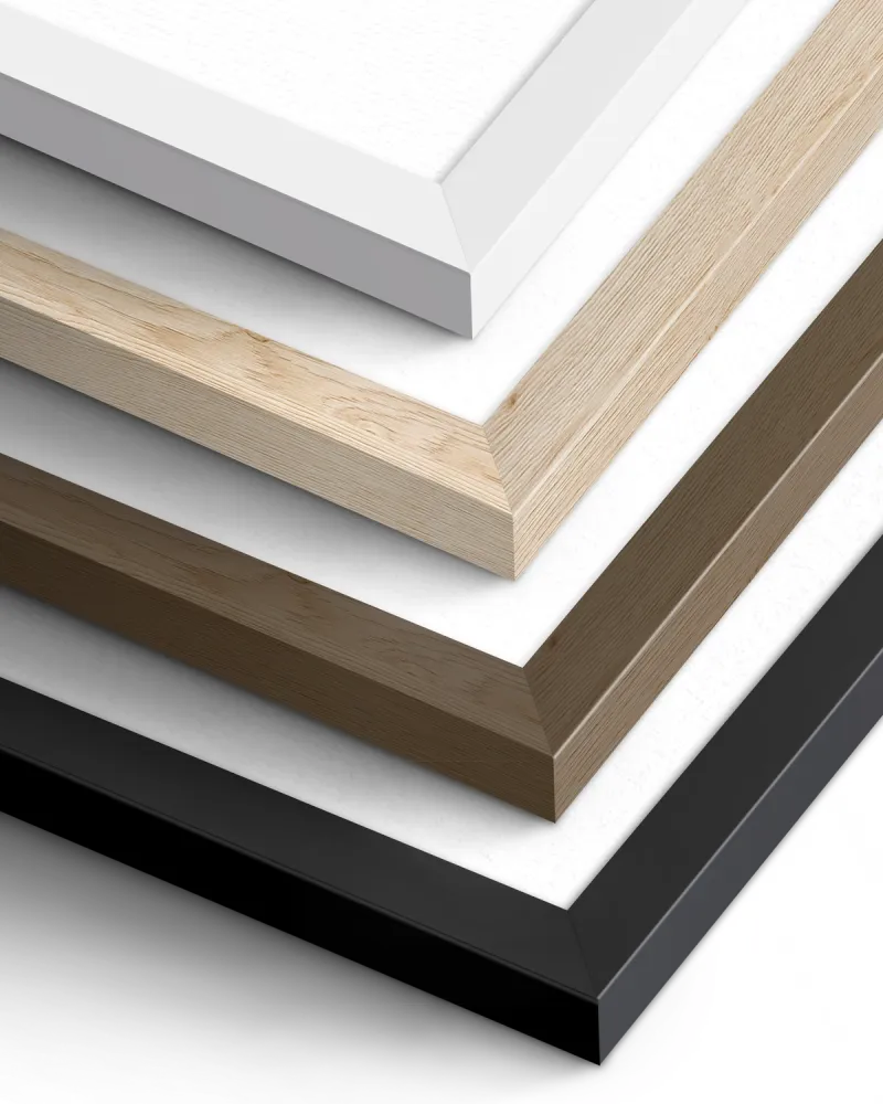 A close up the four different wood frame options available in black, white, walnut and birch